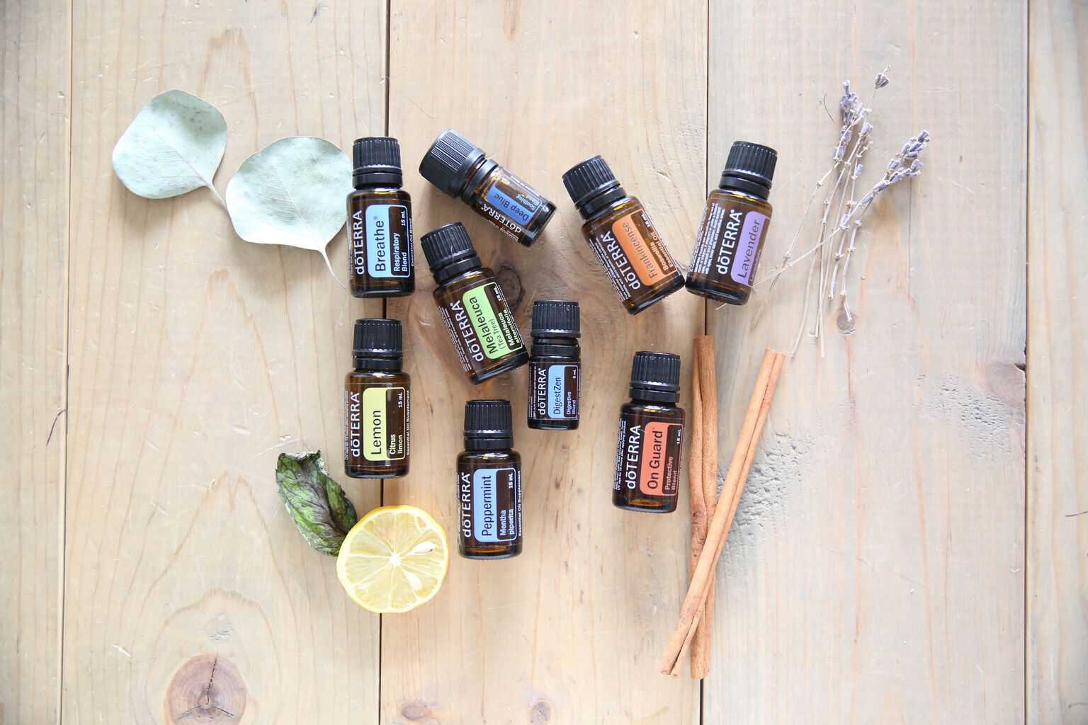 doterra essential oils spread out on wooden table