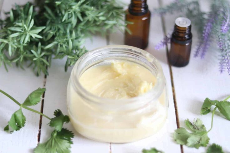 Whipped body butter in a glass travel container.