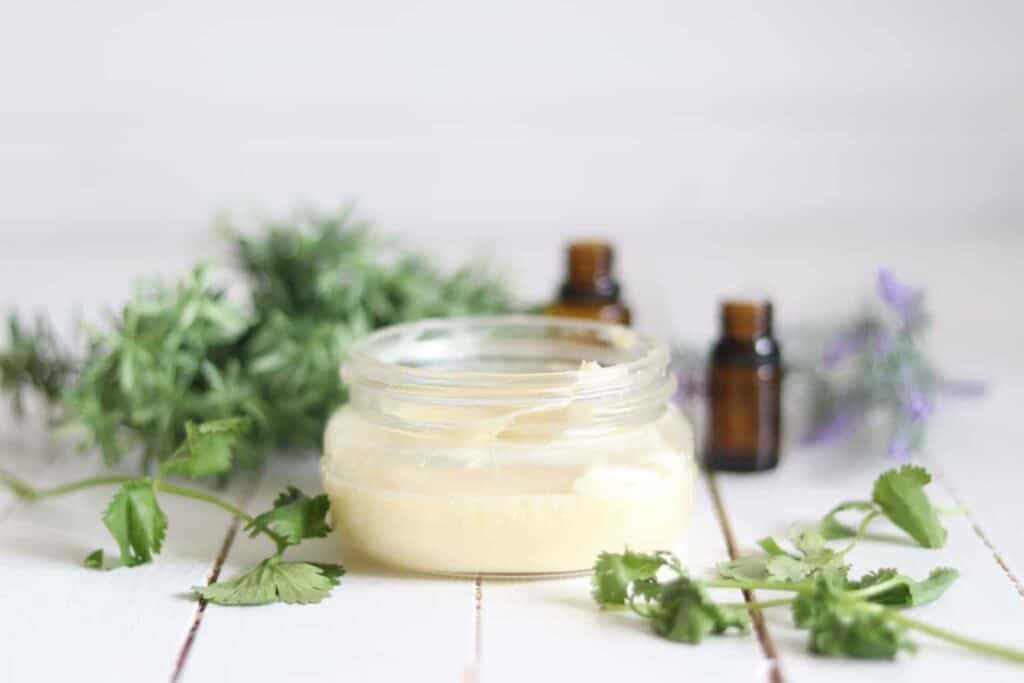 Whipped body butter recipe in a glass storage jar.
