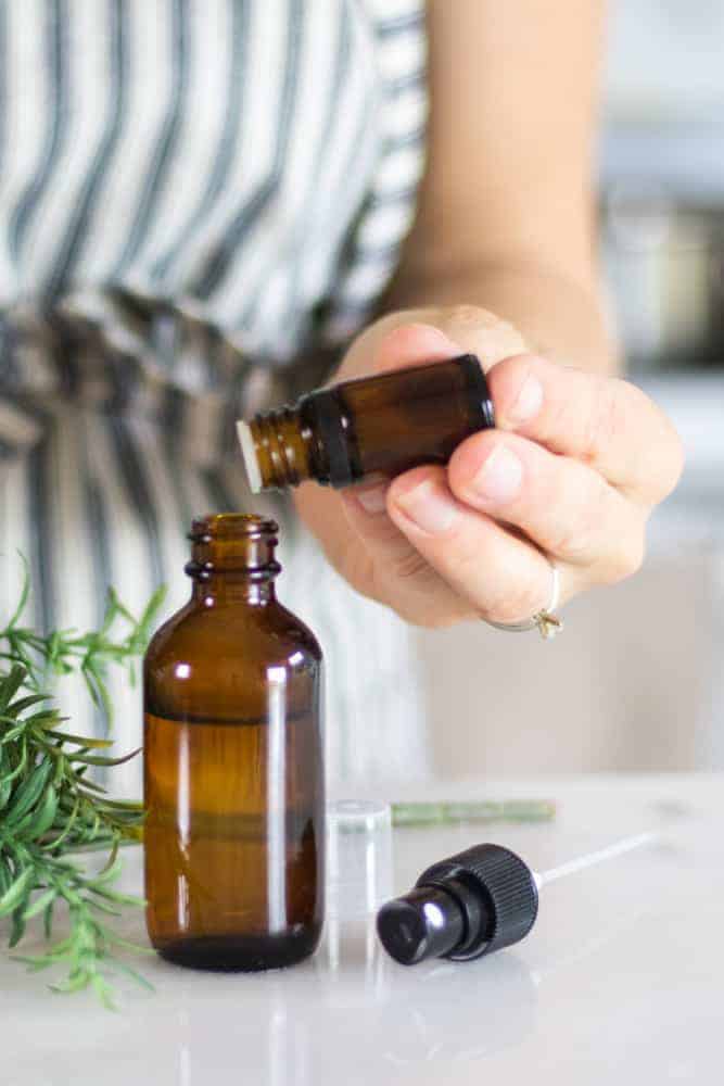 Adding oils to an essential oil ant spray.