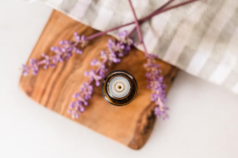 Lavender essential oil in amber colored bottle with dropper top.