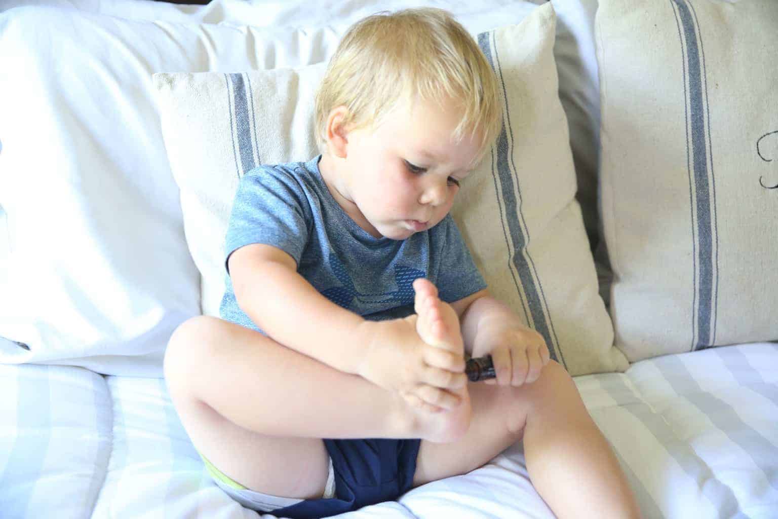 applying an essential oil roller bottle for tantrums