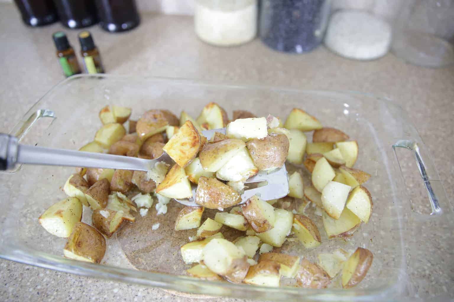 Oven roasted potatoes in glass dish