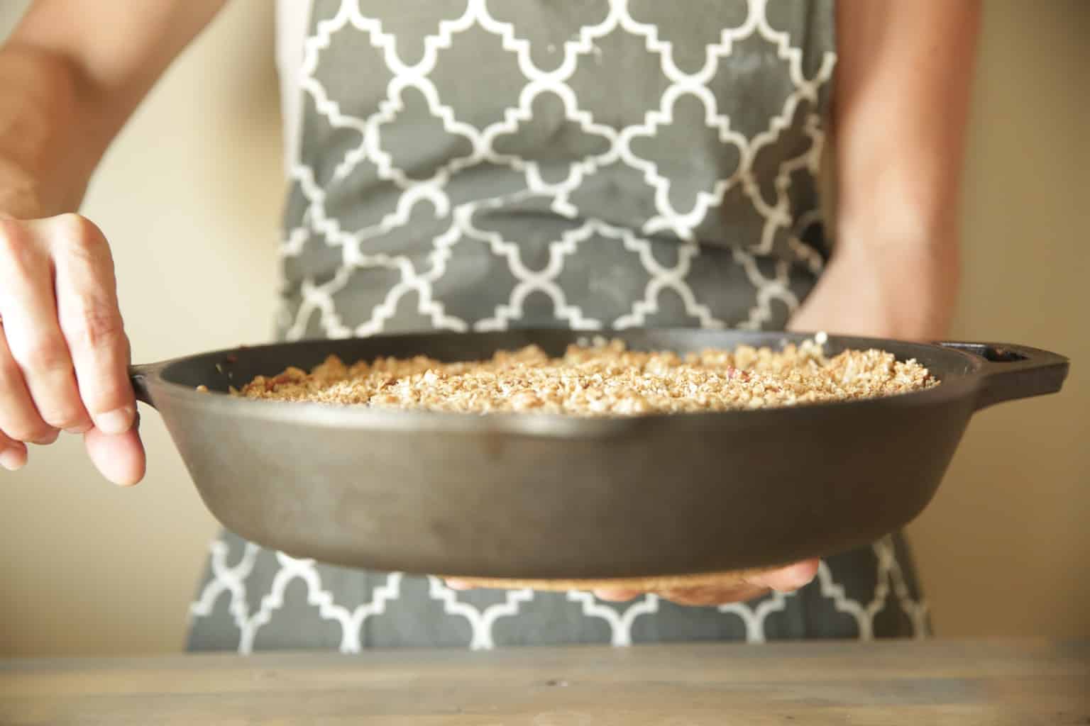 lodge cast iron skillet being set on table