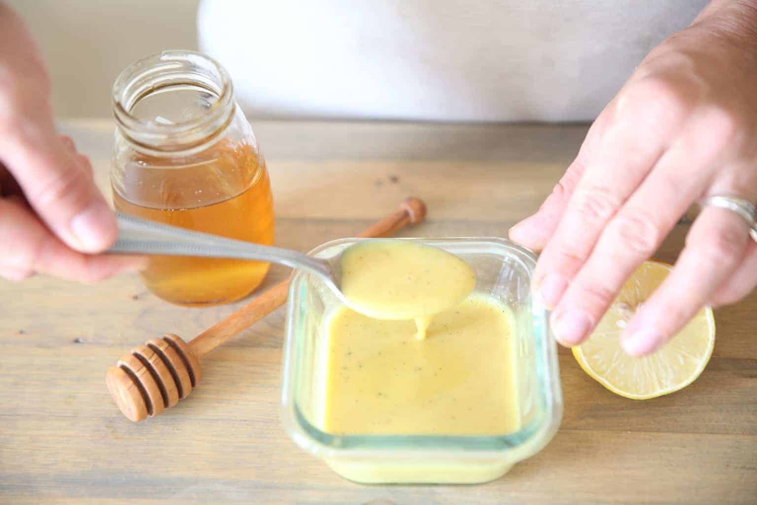 mixing ingredients for a lemon honey mustard dressing