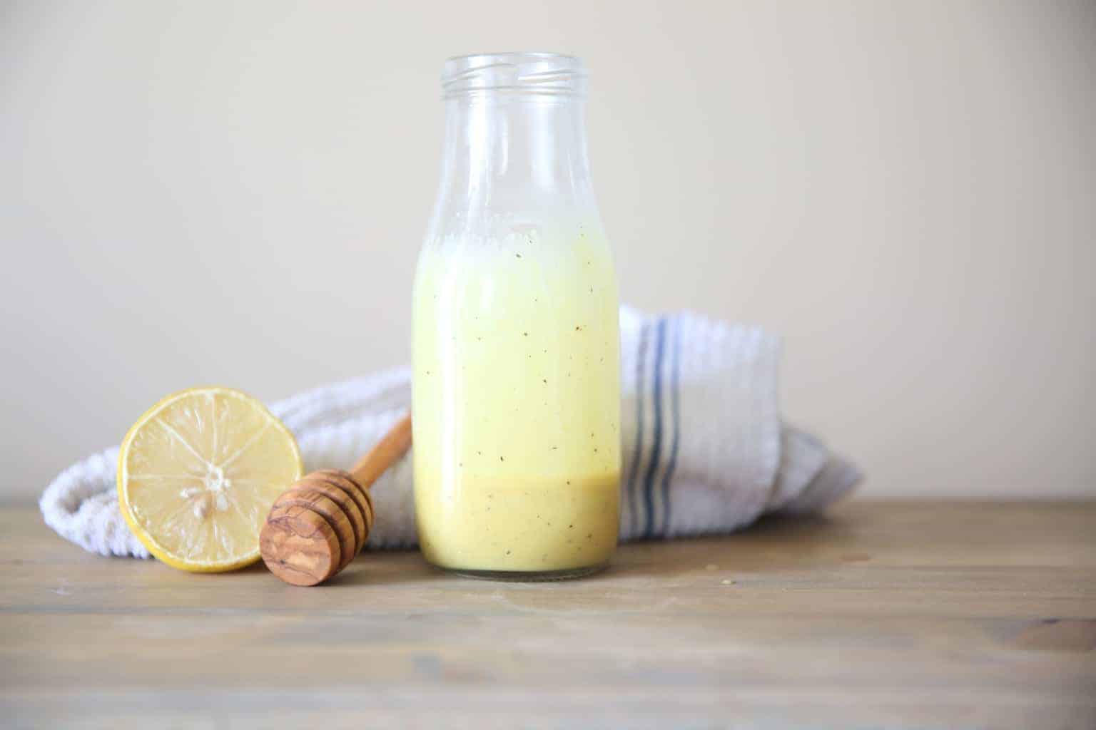 lemon honey mustard dressing in glass dressing jar