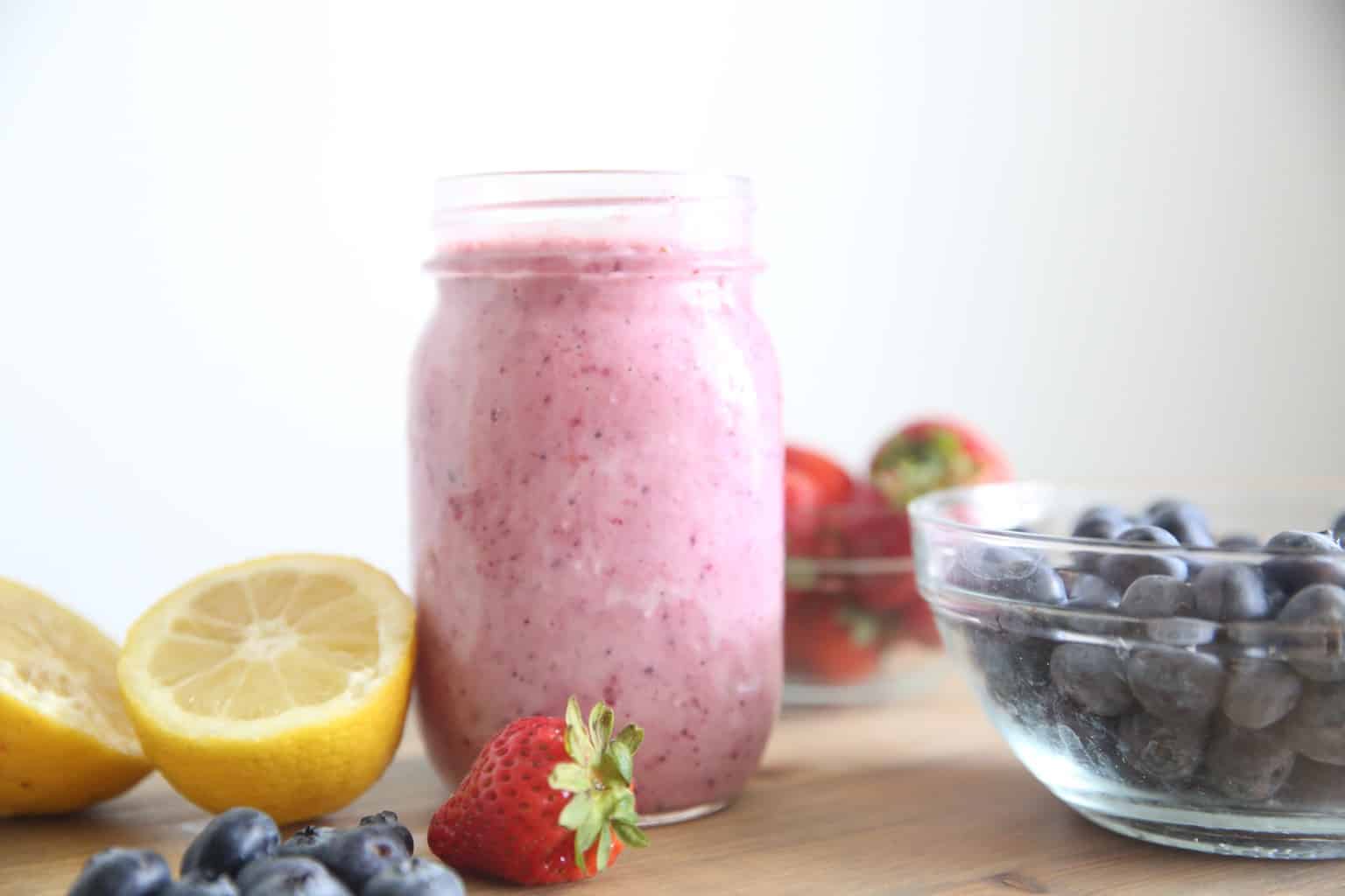 homemade lemon berry smoothie on wooden table top