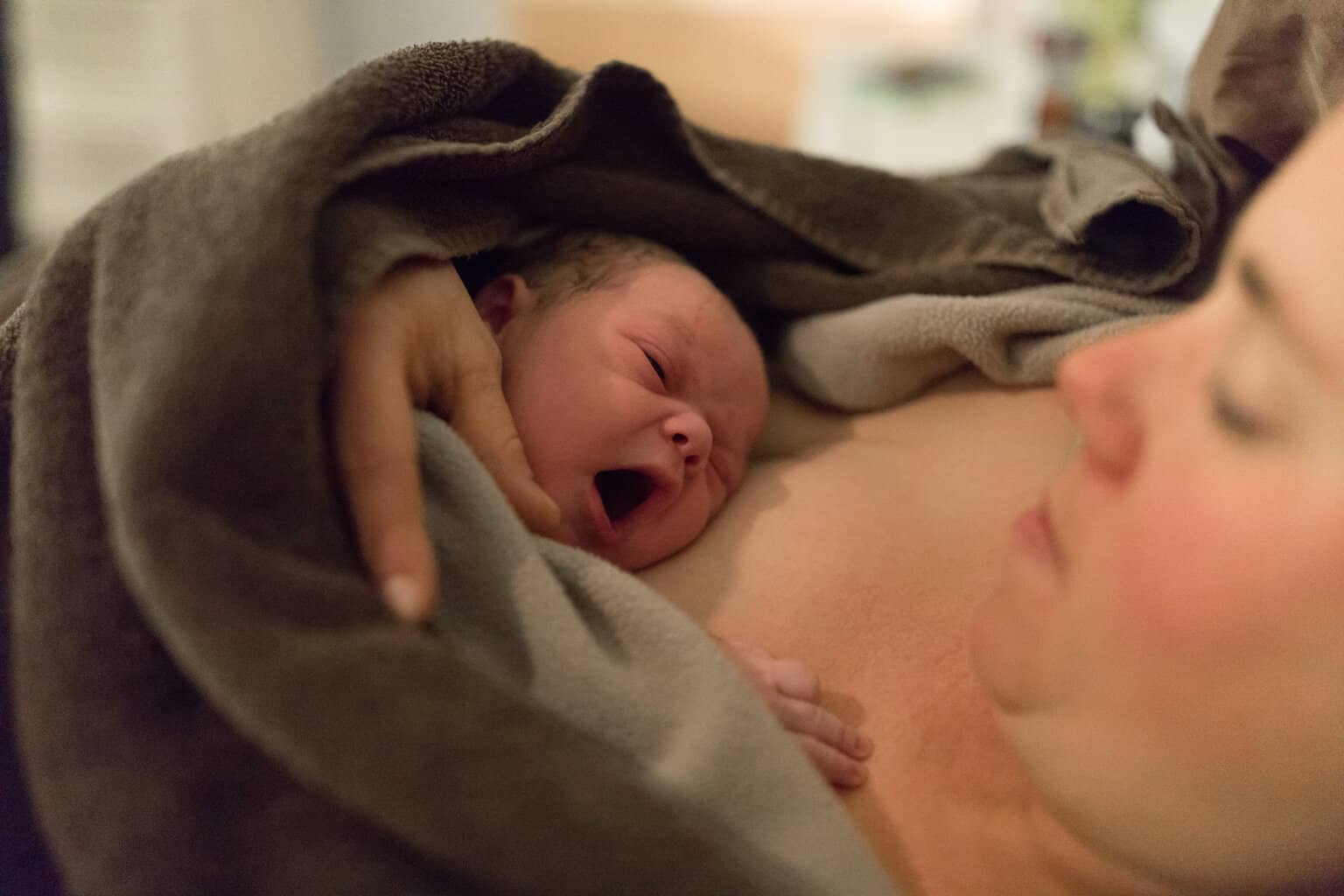 newborn baby on mother