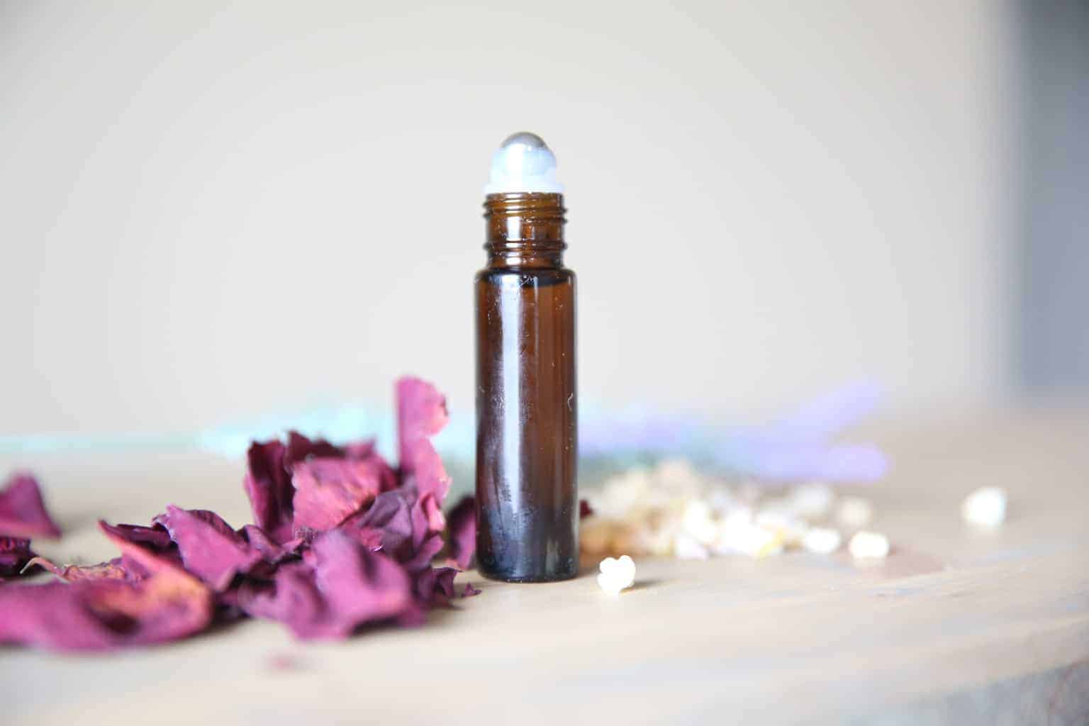 anti-aging roller bottle with dried rose petals
