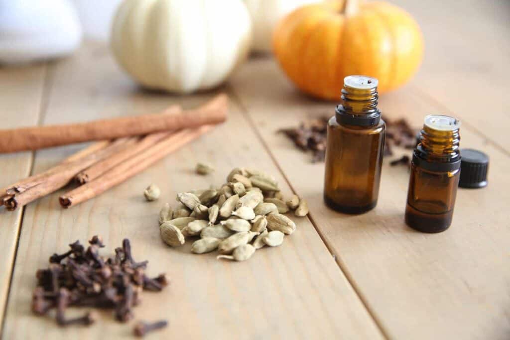 Dried spices, nuts and herbs on a wooden table.