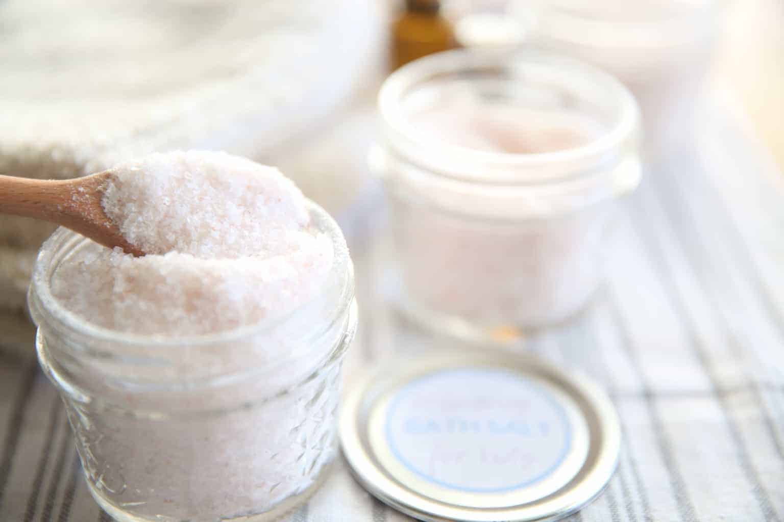 Homemade calming bath salts for kids in a small glass jar.