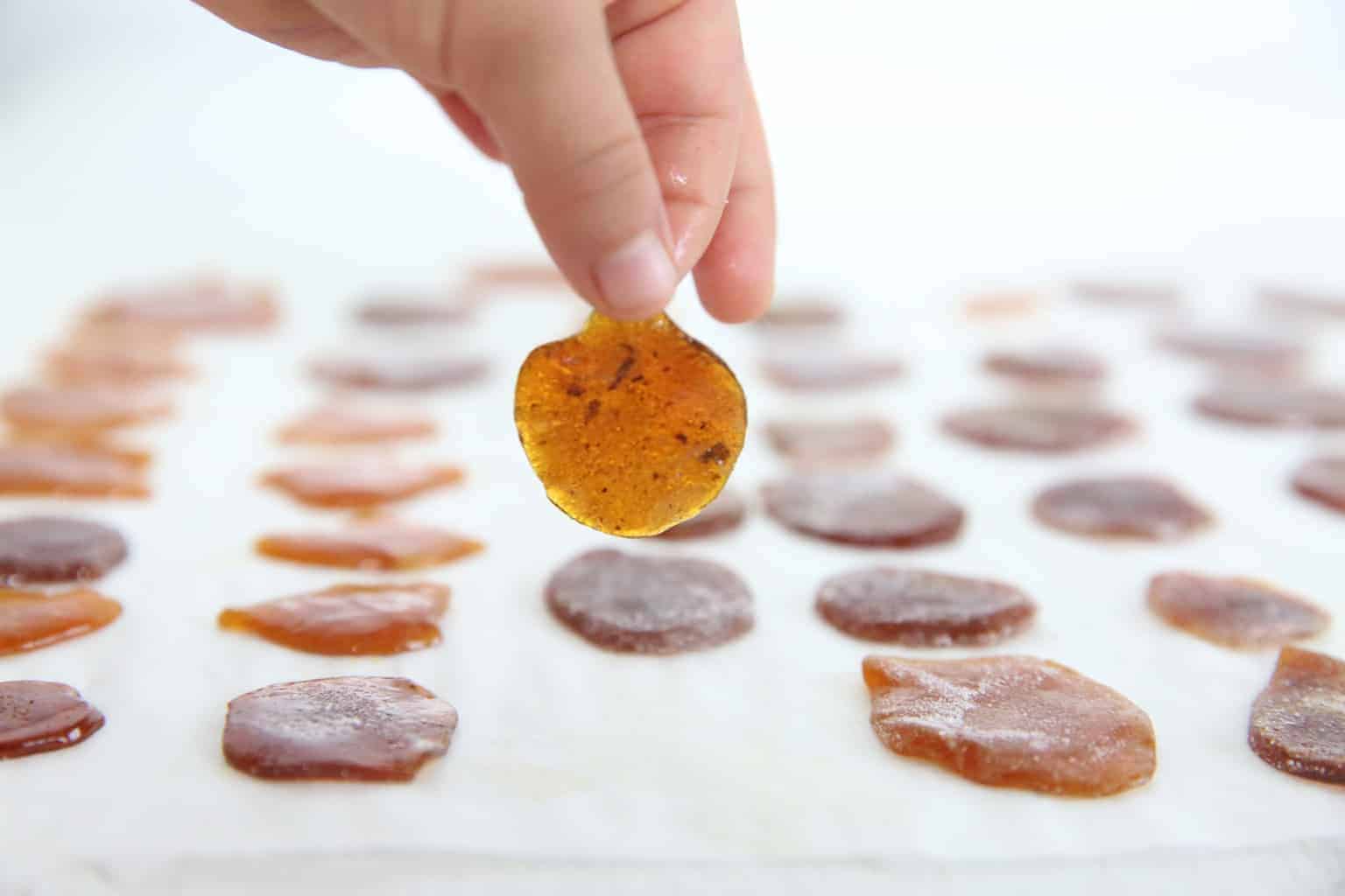 Homemade cough drops on parchment paper.