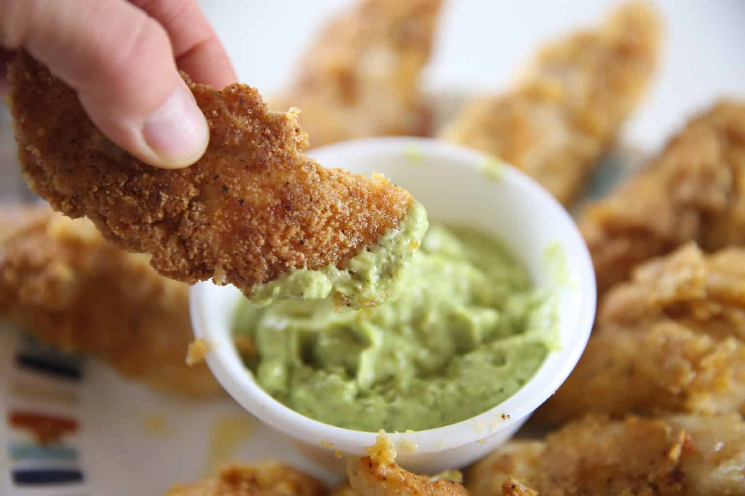 Homemade chicken strips with creamy avocado dip.