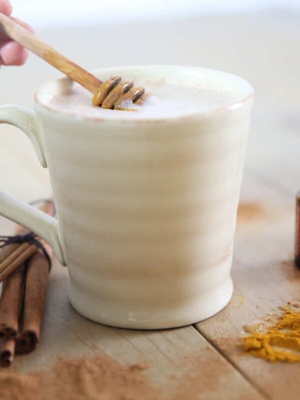 Stirring honey into golden milk.