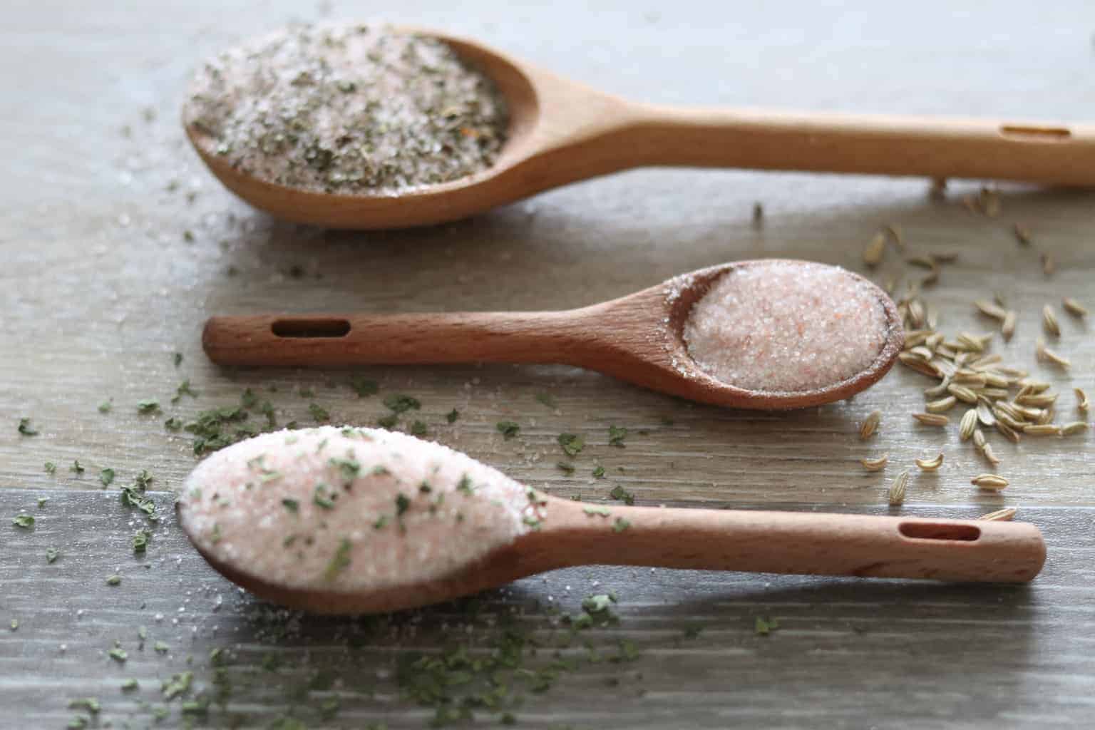 Seasonings in wooden measuring spoons.