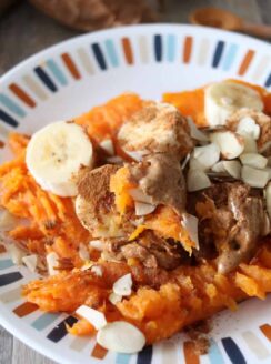 This delicious loaded sweet potato is whole 30 and paleo approved and a perfect snack for the whole family. Baked sweet potatoes with bananas, cinnamon, almonds, and almond butter.