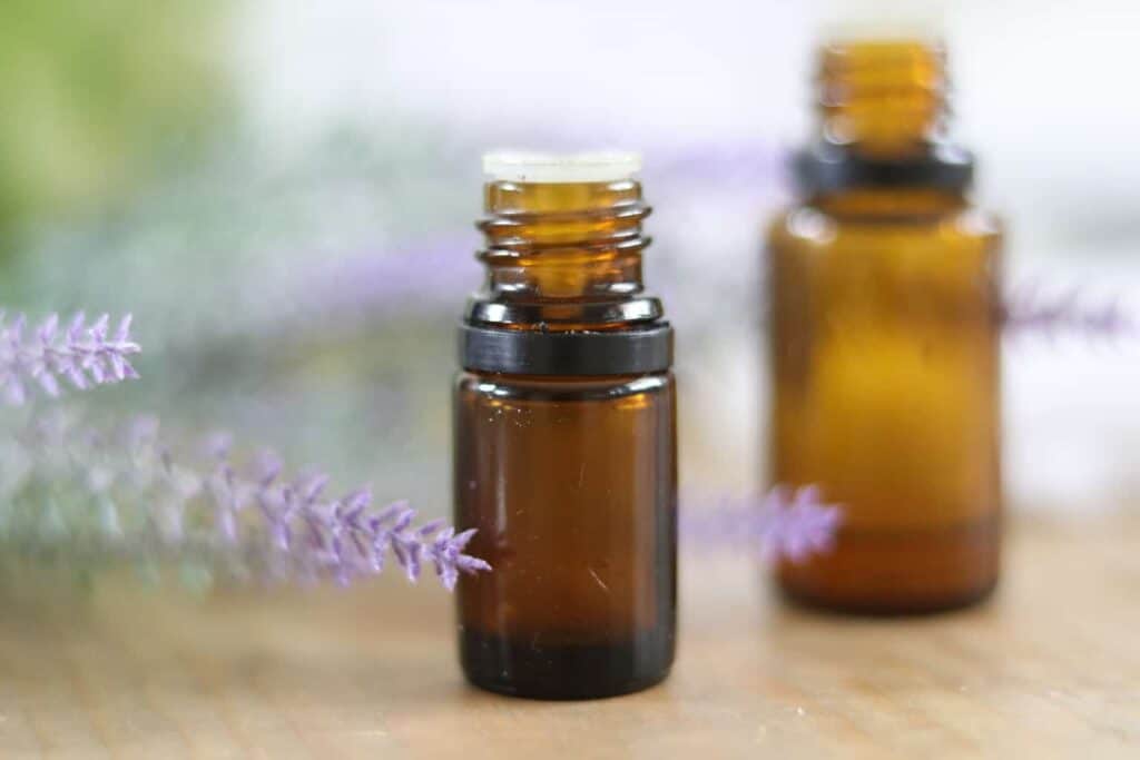 2 oil bottles with lavender sprigs for scenting dryer sheets.