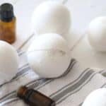 Homemade bath bombs on white shiplap.