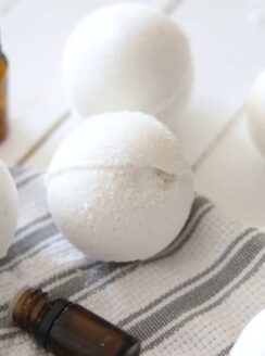 Homemade bath bombs on white shiplap.