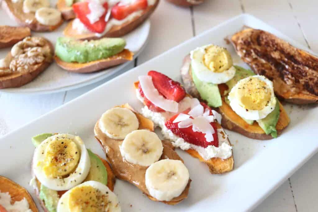 Sweet potato toast slices with banana, eggs and other ingredients on a serving platter.