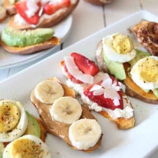 Sweet potato toast slices with banana, eggs and other ingredients on a serving platter.