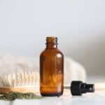 Learn how to make a nourishing hair serum with this simple recipe using nettle tea, essential oils, and aloe.