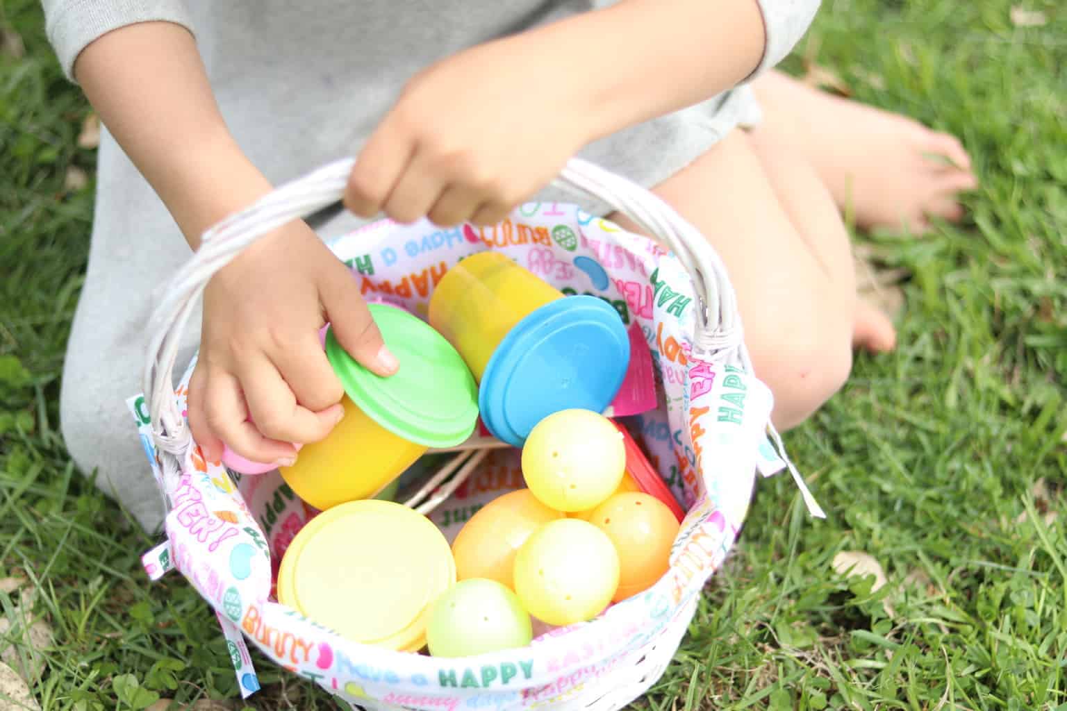 Little girl holding Easter basket.