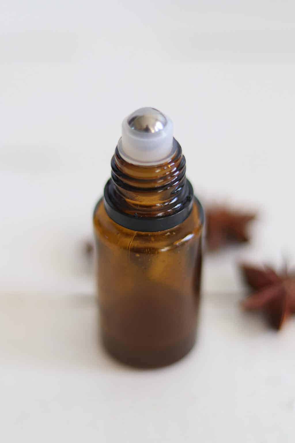 Essential oil roller bottle in white background.