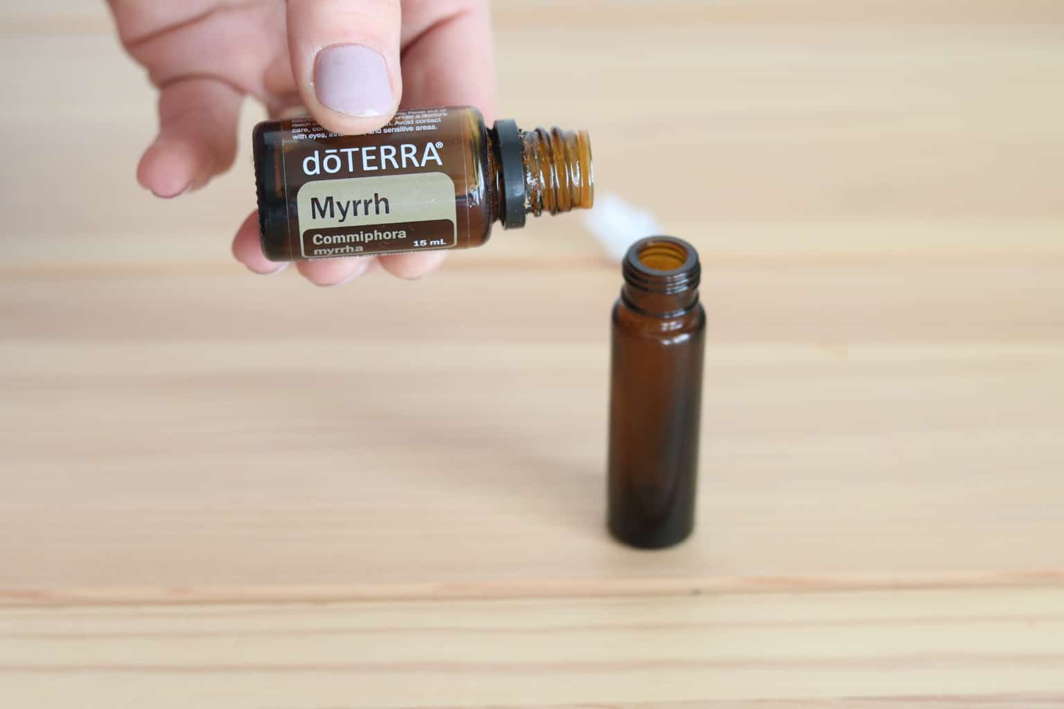 Myrrh essential oil and roller bottle.