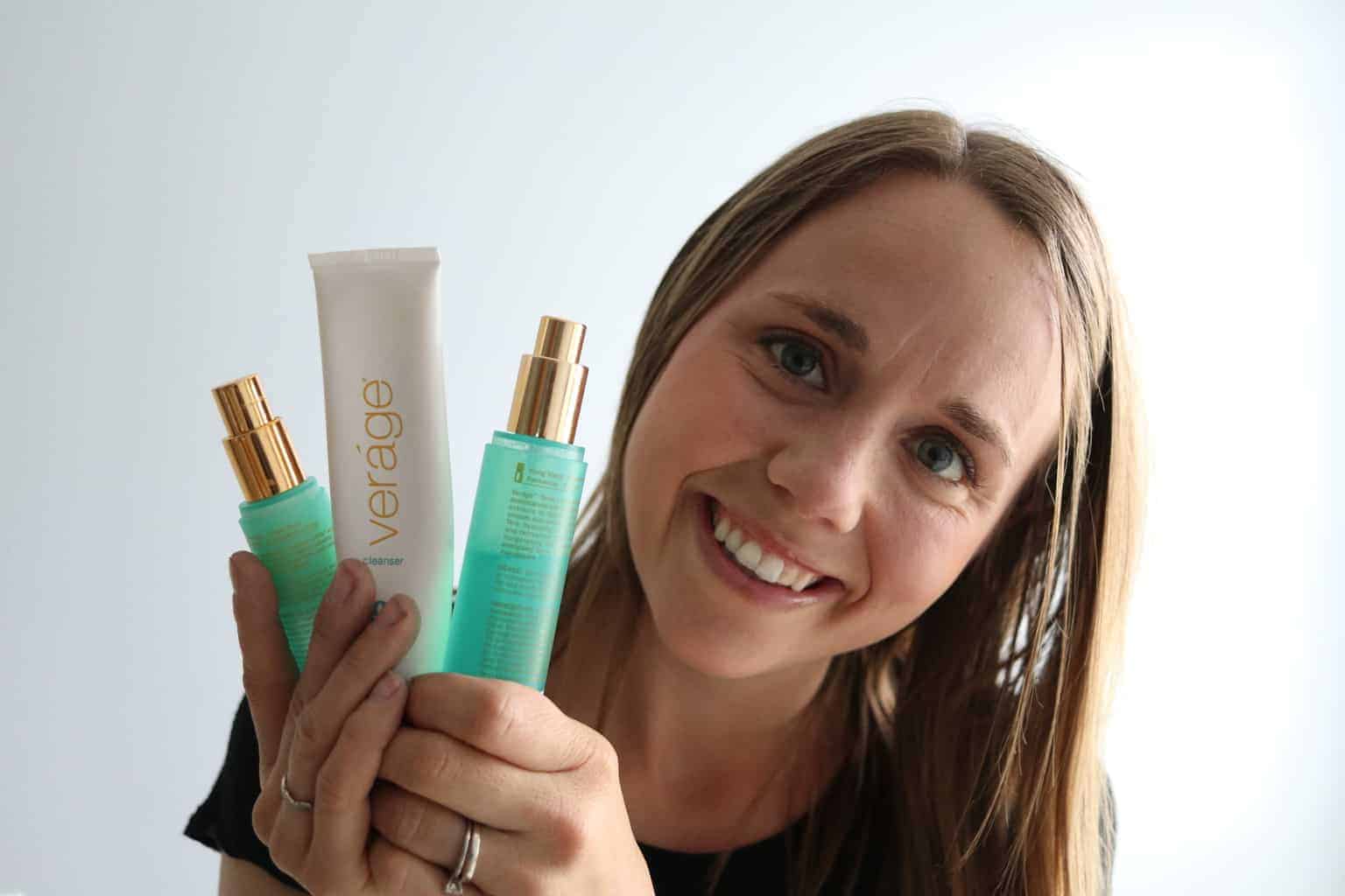 A women holding doTERRA verage skin care line natural products.