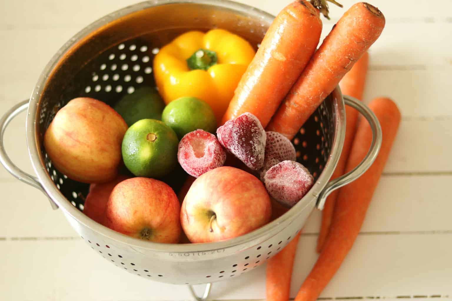 Fruit and vegetables in a strainer.