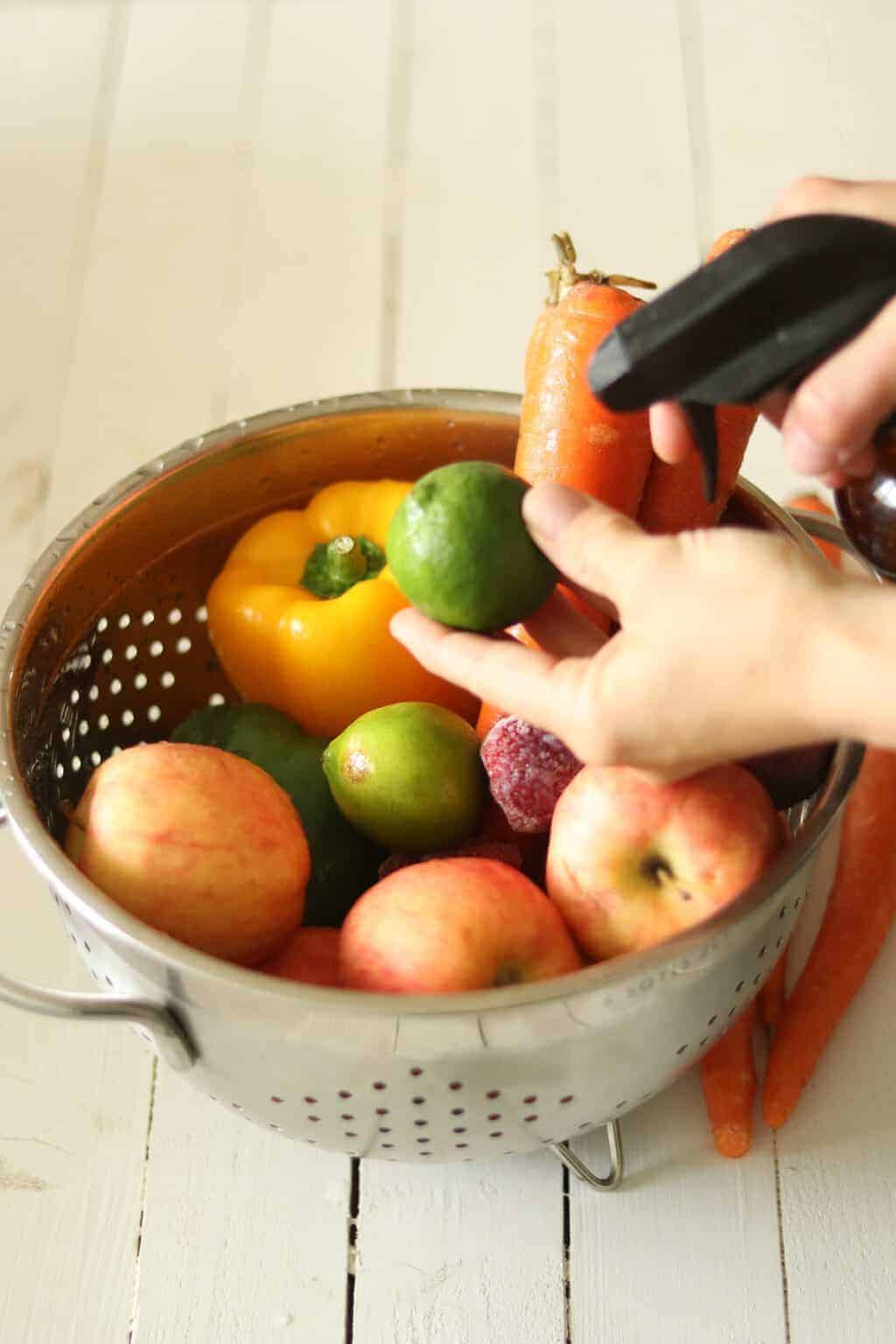 Fruit and vegetables in mettle strainer.
