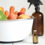 fruit in a white bowl with spray bottle