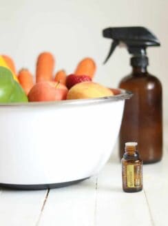 fruit in a white bowl with spray bottle