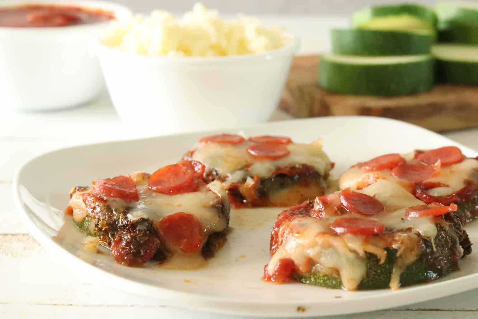 Mini zucchini pizzas with mini pepperoni.