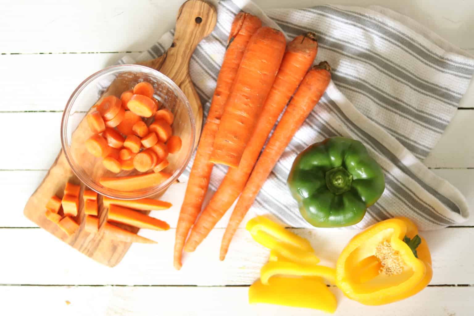 Fresh vegetables on white table.