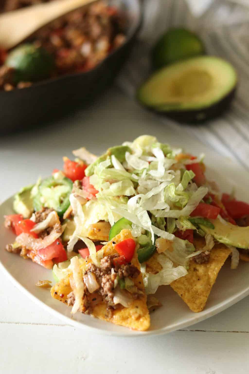 Paleo nachos on white plate.