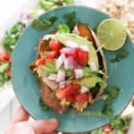 mexican style stiffed sweet potato on blue plate