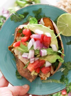 mexican style stiffed sweet potato on blue plate