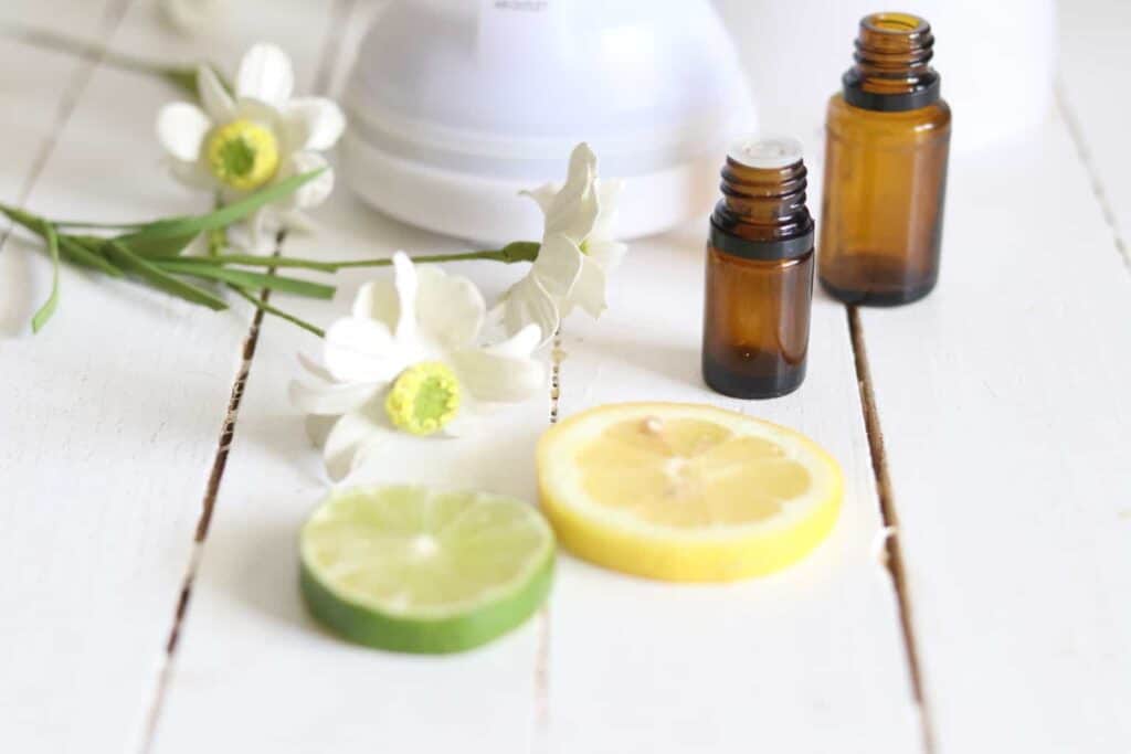 Summer diffuser blend essential oils with fresh lemon and lime slices.