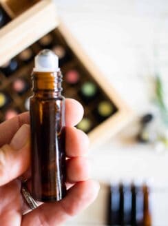 essential oil roller bottle and wooden storage case