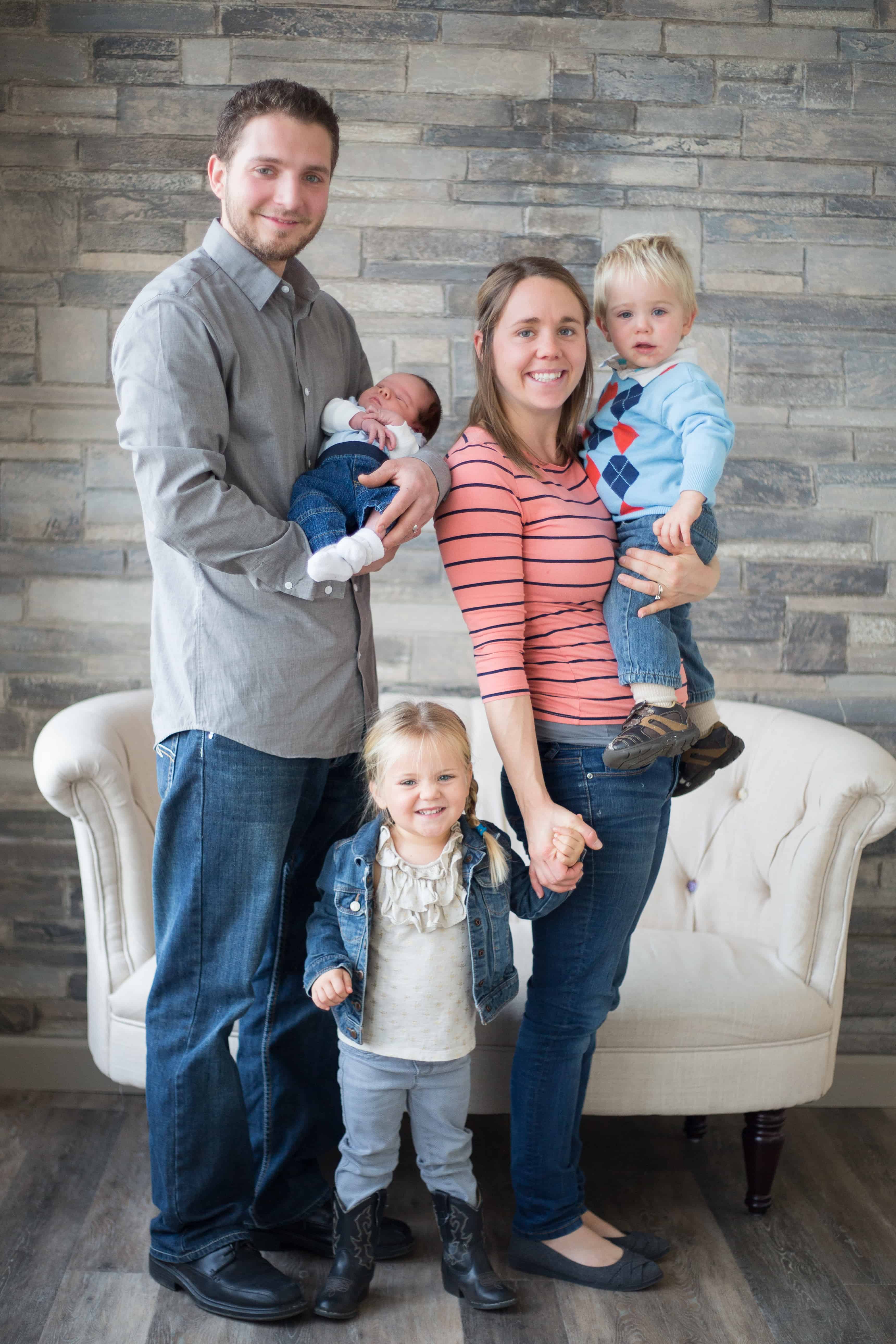 Family picture with couch in background.