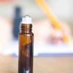 essential oil roller bottle on table