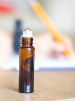 essential oil roller bottle on table