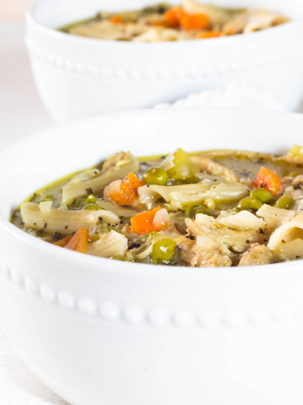 healthy turkey noodle soup in white bowl
