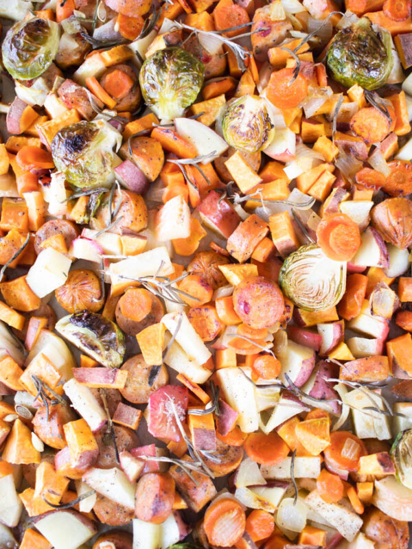 roasted vegetables and sausage on sheet pan.