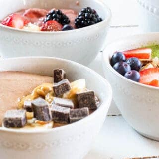 smoothie bowls with toppings in white bowls