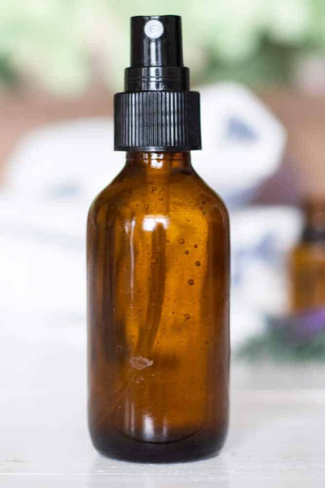 Homemade spray deodorant in amber color glass spray bottle.