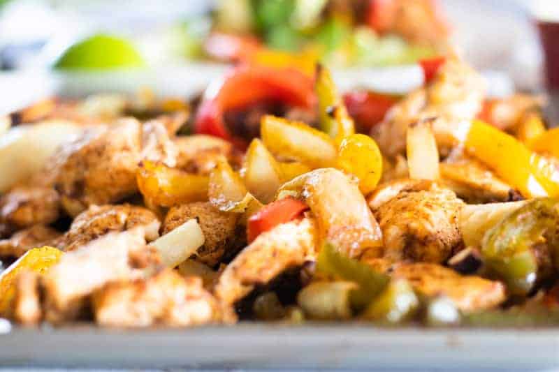 Fajita chicken and peppers on sheet pan.