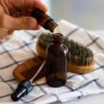 Adding essential oils to aftershave.